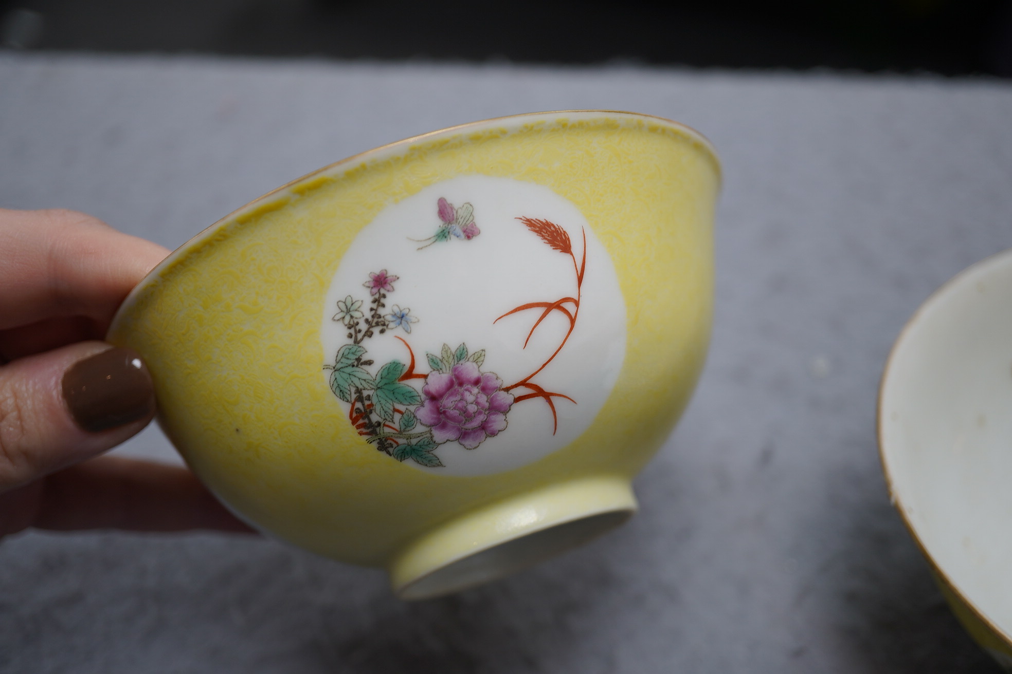 A pair of Chinese yellow sgraffito ground medallion bowls, Guangxu mark, early 20th century